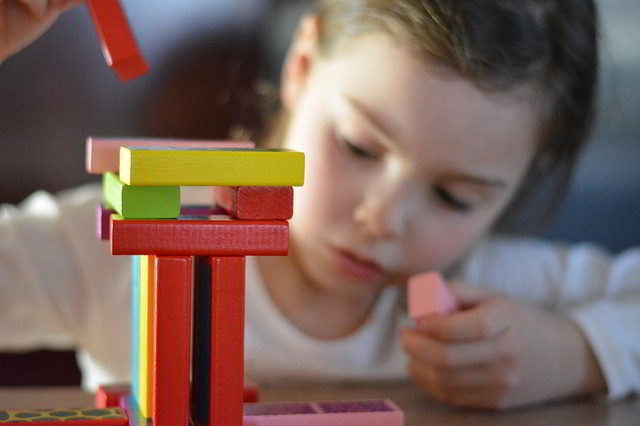 little girl with building blocks