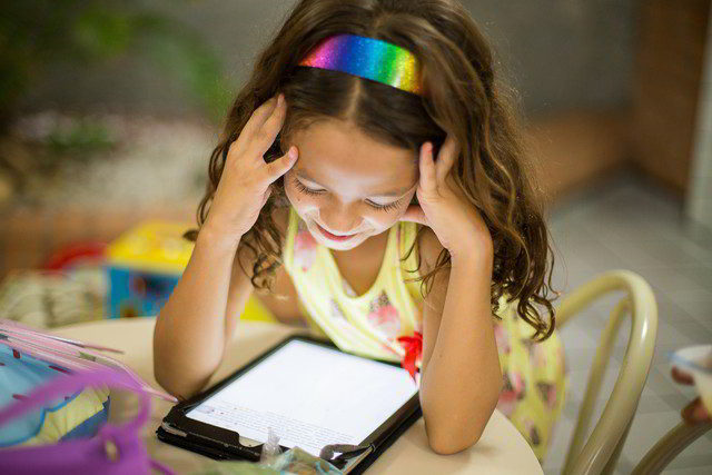 mobile learning - girl reading from tablet