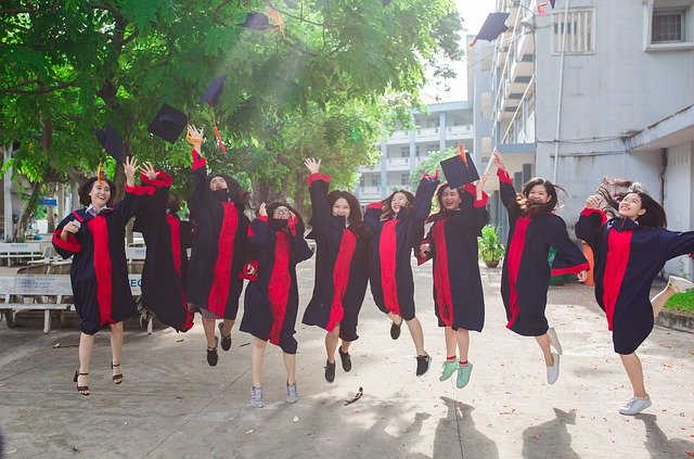 students celebrating passing physics exams